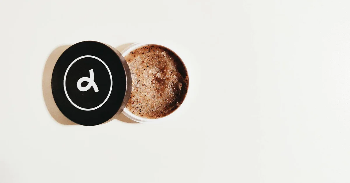 Open container of a body scrub with a textured mixture inside